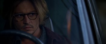 Movie still from “Secret Window” (2004), directed by David Koepp – A person wearing glasses; Close Up shot, Over the shoulder angle