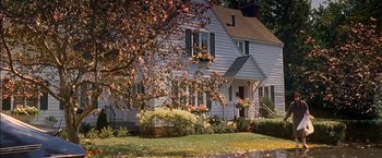 Movie still from “Secret Window” (2004), directed by David Koepp – A white house sitting next to a lush green tree; Extreme Wide shot, High angle
