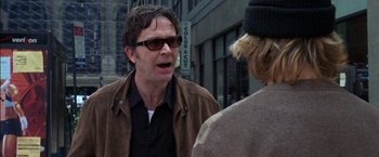 Movie still from “Secret Window” (2004), directed by David Koepp – A man wearing sunglasses talking to a woman; Close Up shot, Over the shoulder angle