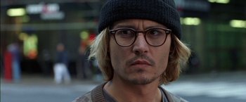 Movie still from “Secret Window” (2004), directed by David Koepp – A person wearing glasses and a hat; Close Up shot, High angle