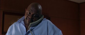 Movie still from “Secret Window” (2004), directed by David Koepp – A man with a beard talking on a phone; Close Up shot, Low angle