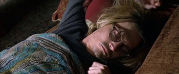 Movie still from “Secret Window” (2004), directed by David Koepp – A man laying on the ground with his eyes closed; Close Up shot, Overhead angle
