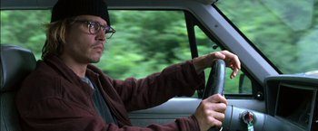 Movie still from “Secret Window” (2004), directed by David Koepp – A man driving a car in a forest; Close Up shot, Low angle