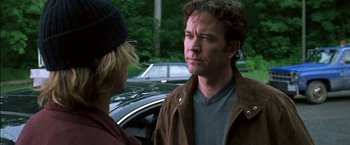 Movie still from “Secret Window” (2004), directed by David Koepp – A man standing next to another man in front of a car; Close Up shot, Over the shoulder angle