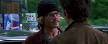 Movie still from “Secret Window” (2004), directed by David Koepp – A man wearing glasses and a hat talking to another man; Close Up shot, Over the shoulder angle