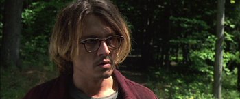 Movie still from “Secret Window” (2004), directed by David Koepp – A person wearing glasses and a jacket; Close Up shot, Over the shoulder angle