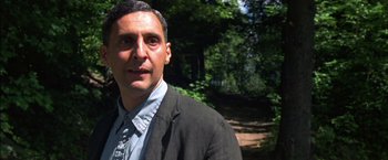 Movie still from “Secret Window” (2004), directed by David Koepp – A person wearing a suit and tie; Close Up shot, Over the shoulder angle