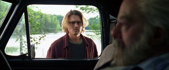Movie still from “Secret Window” (2004), directed by David Koepp – Johnny depp looking in the mirror in the back of a car; Close Up shot, Over the shoulder angle