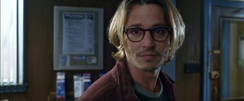 Movie still from “Secret Window” (2004), directed by David Koepp – A person wearing glasses and a brown jacket; Close Up shot, Over the shoulder angle