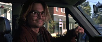 Movie still from “Secret Window” (2004), directed by David Koepp – A man with glasses sitting in the back of a car; Close Up shot, Over the shoulder angle