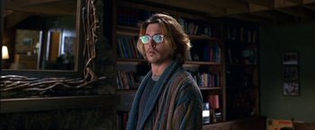 Movie still from “Secret Window” (2004), directed by David Koepp – A man with long blonde hair wearing a sweater; Medium shot, Low angle