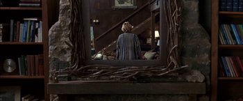 Movie still from “Secret Window” (2004), directed by David Koepp – A woman standing in front of a mirror looking in a mirror; Wide shot, Over the shoulder angle