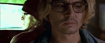 Movie still from “Secret Window” (2004), directed by David Koepp – A person wearing glasses; Close Up shot, Overhead angle