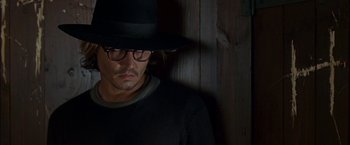 Movie still from “Secret Window” (2004), directed by David Koepp – A person wearing glasses and a hat; Close Up shot, Over the shoulder angle