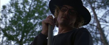 Movie still from “Secret Window” (2004), directed by David Koepp – A man in a black hat holding a stick; Close Up shot, Low angle