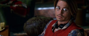 Movie still from “Secret Window” (2004), directed by David Koepp – A person wearing headphones and glasses; Close Up shot, Over the shoulder angle