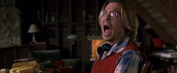 Movie still from “Secret Window” (2004), directed by David Koepp – A man with glasses and a red apron is screaming; Close Up shot, Low angle