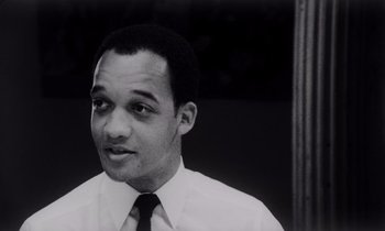 Movie still from “She's Gotta Have It” (1986), directed by Spike Lee – A black and white photo of a man wearing a tie; Close Up shot, Low angle