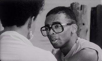 Movie still from “She's Gotta Have It” (1986), directed by Spike Lee – A black and white photo of a man and a woman; Close Up shot, Over the shoulder angle