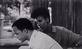 Movie still from “She's Gotta Have It” (1986), directed by Spike Lee – A black and white photo of a man and a woman; Close Up shot, Over the shoulder angle