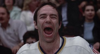 Movie still from “Slap Shot” (1977), directed by George Roy Hill – A person with mouth open; Close Up shot, Low angle