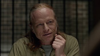 Movie still from “Slasher” (2016), created by Aaron Martin – A person with long red hair; Close Up shot, Over the shoulder angle