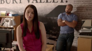Movie still from “Slasher” (2016), created by Aaron Martin – A woman in a pink shirt and a man in a blue shirt; Medium shot, Over the shoulder angle
