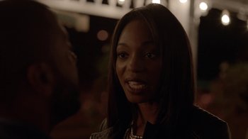 Movie still from “Slasher” (2016), created by Aaron Martin – A person wearing a black jacket; Close Up shot, Over the shoulder angle