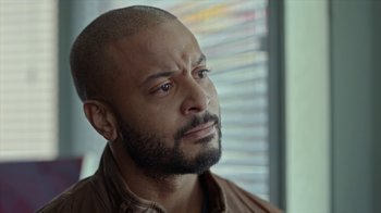 Movie still from “Slasher” (2016), created by Aaron Martin – A person with a beard; Close Up shot, Over the shoulder angle