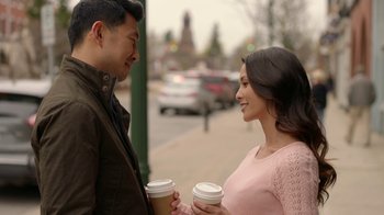 Movie still from “Slasher” (2016), created by Aaron Martin – A man and a woman are holding cups of coffee; Medium shot, Over the shoulder angle
