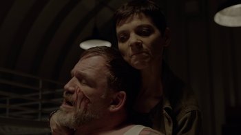 Movie still from “Slasher” (2016), created by Aaron Martin – A man and a woman with their faces covered in fake blood; Close Up shot, Over the shoulder angle