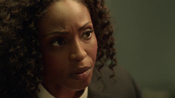Movie still from “Slasher” (2016), created by Aaron Martin – A person with curly hair; Close Up shot, Over the shoulder angle
