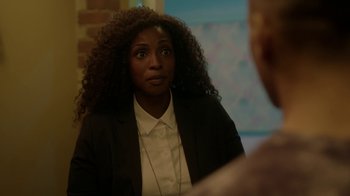 Movie still from “Slasher” (2016), created by Aaron Martin – A woman in a black jacket is looking at a man in a white shirt; Close Up shot, Over the shoulder angle