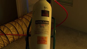 Movie still from “Breaking Bad” (2008), created by Vince Gilligan – A fire extinguisher is sitting on the floor; Extreme Close Up shot, High angle