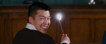 Movie still from “Spider-Man 3” (2007), directed by Sam Raimi – A young man holding a light in his hand; Close Up shot, Over the shoulder angle