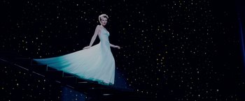 Movie still from “Spider-Man 3” (2007), directed by Sam Raimi – A woman in a white dress standing on a platform; Wide shot, Low angle
