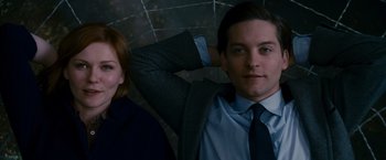 Movie still from “Spider-Man 3” (2007), directed by Sam Raimi – A man and a woman posing for a picture; Close Up shot, Low angle