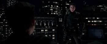 Movie still from “Spider-Man 3” (2007), directed by Sam Raimi – A man standing in front of a city at night; Medium shot, Over the shoulder angle
