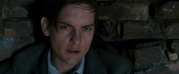 Movie still from “Spider-Man 3” (2007), directed by Sam Raimi – A person wearing a suit and tie; Close Up shot, High angle