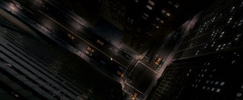 Movie still from “Spider-Man 3” (2007), directed by Sam Raimi – An aerial view of a city street at night; Extreme Wide shot, Overhead angle