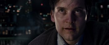 Movie still from “Spider-Man 3” (2007), directed by Sam Raimi – A man's face at night; Close Up shot, Low angle