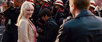 Movie still from “Spider-Man 3” (2007), directed by Sam Raimi – A group of people in a crowd of men in uniform; Medium shot, Over the shoulder angle