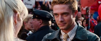 Movie still from “Spider-Man 3” (2007), directed by Sam Raimi – A person wearing a jacket and a tie; Close Up shot, Over the shoulder angle