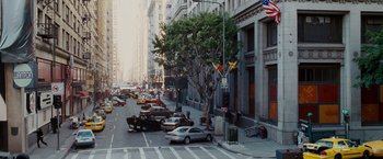 Movie still from “Spider-Man 3” (2007), directed by Sam Raimi – Cars parked on the side of the road near a tree; Extreme Wide shot, High angle