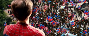 Movie still from “Spider-Man 3” (2007), directed by Sam Raimi – A crowd of people are gathered in the middle of the street; Extreme Wide shot, Overhead angle