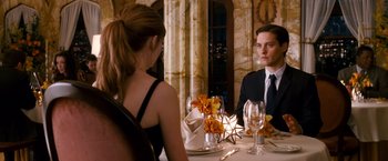 Movie still from “Spider-Man 3” (2007), directed by Sam Raimi – A man and a woman sitting at a dinner table; Medium shot, Over the shoulder angle