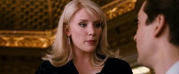 Movie still from “Spider-Man 3” (2007), directed by Sam Raimi – A woman with blonde hair wearing a black top; Close Up shot, Over the shoulder angle