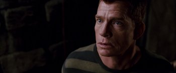 Movie still from “Spider-Man 3” (2007), directed by Sam Raimi – A person wearing a striped sweater; Close Up shot, High angle