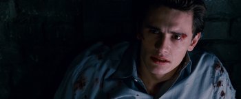 Movie still from “Spider-Man 3” (2007), directed by Sam Raimi – A person with blood on his face; Close Up shot, High angle