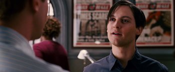 Movie still from “Spider-Man 3” (2007), directed by Sam Raimi – A man standing in front of another man; Close Up shot, Over the shoulder angle